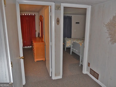 Escape the heat and enjoy cool mountain living in this furnished on Sky Valley Resort and Country Club in Georgia - for sale on GolfHomes.com, golf home, golf lot