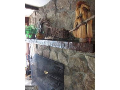 Escape the heat and enjoy cool mountain living in this furnished on Sky Valley Resort and Country Club in Georgia - for sale on GolfHomes.com, golf home, golf lot