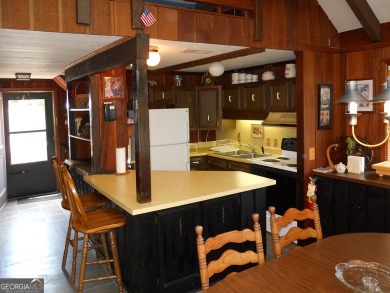 Escape the heat and enjoy cool mountain living in this furnished on Sky Valley Resort and Country Club in Georgia - for sale on GolfHomes.com, golf home, golf lot