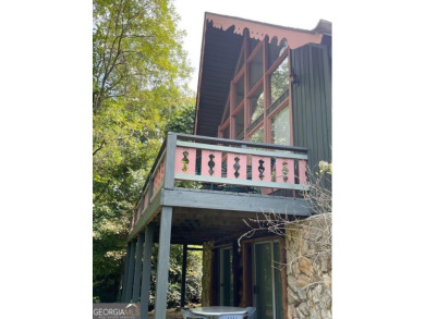 Escape the heat and enjoy cool mountain living in this furnished on Sky Valley Resort and Country Club in Georgia - for sale on GolfHomes.com, golf home, golf lot