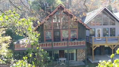 Escape the heat and enjoy cool mountain living in this furnished on Sky Valley Resort and Country Club in Georgia - for sale on GolfHomes.com, golf home, golf lot