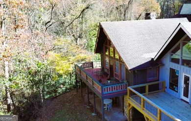 Escape the heat and enjoy cool mountain living in this furnished on Sky Valley Resort and Country Club in Georgia - for sale on GolfHomes.com, golf home, golf lot