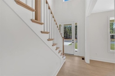 This beautiful two-story home on a full unfinished basement is on The Plantation Golf Club in Georgia - for sale on GolfHomes.com, golf home, golf lot