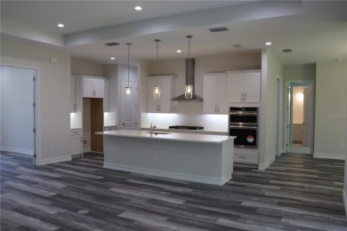 This stunning and luxurious new home by Spire Homes, a on Southern Hills Plantation Club in Florida - for sale on GolfHomes.com, golf home, golf lot