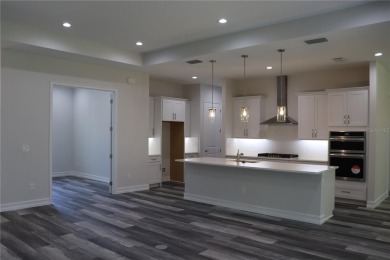 This stunning and luxurious new home by Spire Homes, a on Southern Hills Plantation Club in Florida - for sale on GolfHomes.com, golf home, golf lot