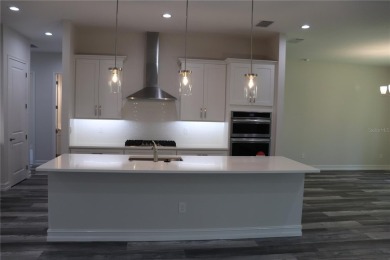 This stunning and luxurious new home by Spire Homes, a on Southern Hills Plantation Club in Florida - for sale on GolfHomes.com, golf home, golf lot