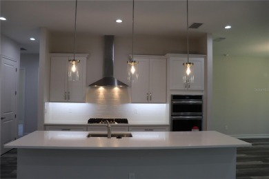 This stunning and luxurious new home by Spire Homes, a on Southern Hills Plantation Club in Florida - for sale on GolfHomes.com, golf home, golf lot