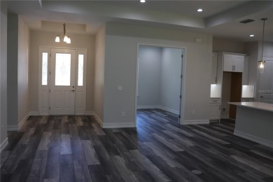 This stunning and luxurious new home by Spire Homes, a on Southern Hills Plantation Club in Florida - for sale on GolfHomes.com, golf home, golf lot
