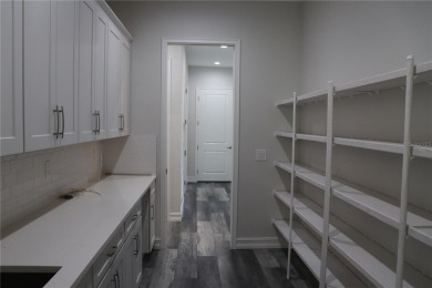 This stunning and luxurious new home by Spire Homes, a on Southern Hills Plantation Club in Florida - for sale on GolfHomes.com, golf home, golf lot