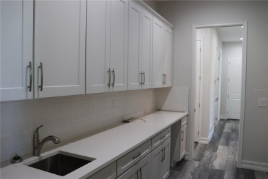 This stunning and luxurious new home by Spire Homes, a on Southern Hills Plantation Club in Florida - for sale on GolfHomes.com, golf home, golf lot