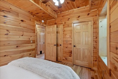 Discover this Custom Built Jubach Log Home perfectly placed on a on Hide-A-Way Hills Golf Club in Ohio - for sale on GolfHomes.com, golf home, golf lot