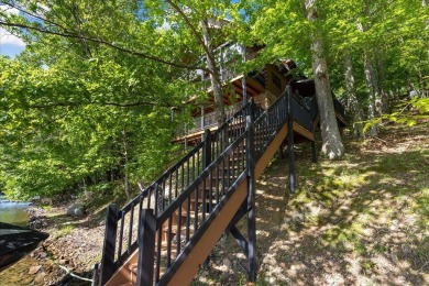 Discover this Custom Built Jubach Log Home perfectly placed on a on Hide-A-Way Hills Golf Club in Ohio - for sale on GolfHomes.com, golf home, golf lot