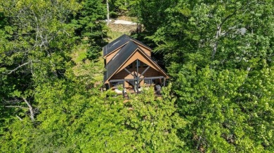 Discover this Custom Built Jubach Log Home perfectly placed on a on Hide-A-Way Hills Golf Club in Ohio - for sale on GolfHomes.com, golf home, golf lot
