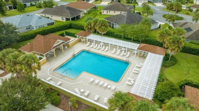 Welcome to this charming 3-bedroom, 2-bathroom bungalow villa on Egret Championship Golf Course in Florida - for sale on GolfHomes.com, golf home, golf lot