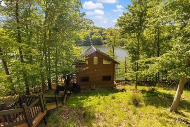 Discover this Custom Built Jubach Log Home perfectly placed on a on Hide-A-Way Hills Golf Club in Ohio - for sale on GolfHomes.com, golf home, golf lot