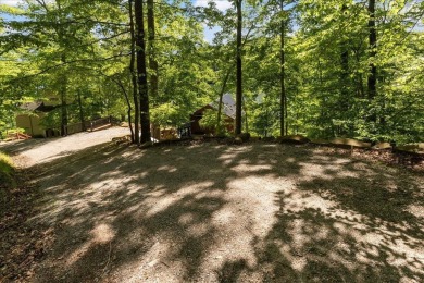Discover this Custom Built Jubach Log Home perfectly placed on a on Hide-A-Way Hills Golf Club in Ohio - for sale on GolfHomes.com, golf home, golf lot