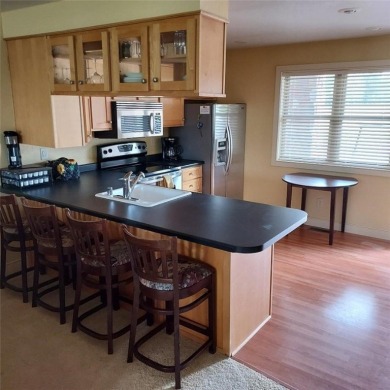 This fully furnished ground level 2BR condo offers excellent on Tagalong Golf Course in Wisconsin - for sale on GolfHomes.com, golf home, golf lot