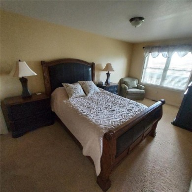 This fully furnished ground level 2BR condo offers excellent on Tagalong Golf Course in Wisconsin - for sale on GolfHomes.com, golf home, golf lot