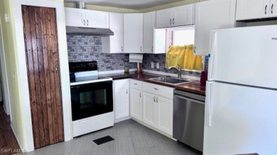 This home has been completely remodeled inside (2023-2024); with on Riverbend Golf and Country Club in Florida - for sale on GolfHomes.com, golf home, golf lot