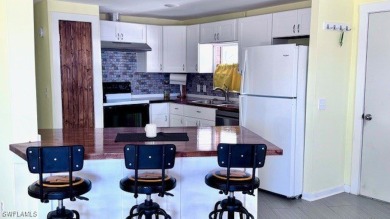 This home has been completely remodeled inside (2023-2024); with on Riverbend Golf and Country Club in Florida - for sale on GolfHomes.com, golf home, golf lot