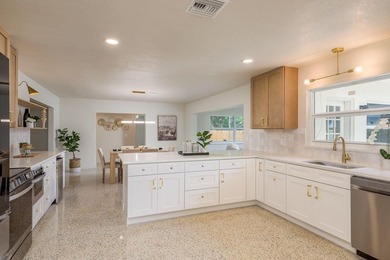 Fully reimagined Fairway Estates home offering over 3,300 sq ft on The Dunedin Country Club in Florida - for sale on GolfHomes.com, golf home, golf lot