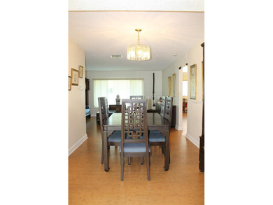 Welcome to this beautifully maintained Eden home with 1598 sq ft on Mainlands Golf Club in Florida - for sale on GolfHomes.com, golf home, golf lot