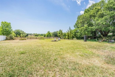 Charming 3-Bedroom Home with Modern Upgrades and Scenic Views in on Oak Hills Country Club in Florida - for sale on GolfHomes.com, golf home, golf lot