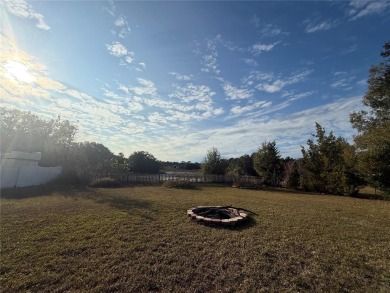 Charming 3-Bedroom Home with Modern Upgrades and Scenic Views in on Oak Hills Country Club in Florida - for sale on GolfHomes.com, golf home, golf lot