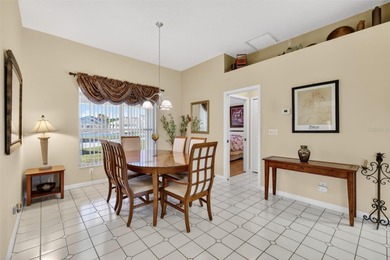 Welcome to this immaculate, light-filled lake view home nestled on Monarch At Royal Highlands in Florida - for sale on GolfHomes.com, golf home, golf lot