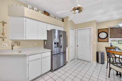 Welcome to this immaculate, light-filled lake view home nestled on Monarch At Royal Highlands in Florida - for sale on GolfHomes.com, golf home, golf lot