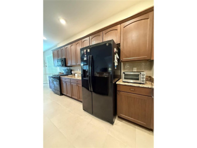 Beautiful golf course home in the 55+ gated community of on Arlington Ridge Golf Club in Florida - for sale on GolfHomes.com, golf home, golf lot