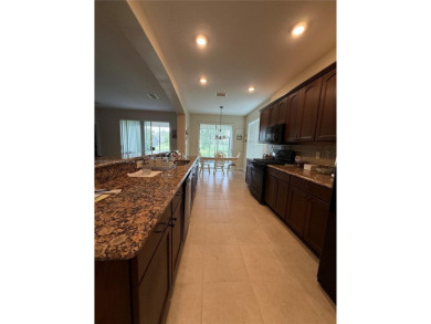 Beautiful golf course home in the 55+ gated community of on Arlington Ridge Golf Club in Florida - for sale on GolfHomes.com, golf home, golf lot