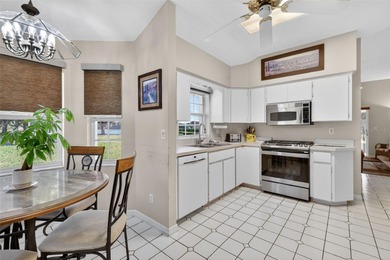 Welcome to this immaculate, light-filled lake view home nestled on Monarch At Royal Highlands in Florida - for sale on GolfHomes.com, golf home, golf lot