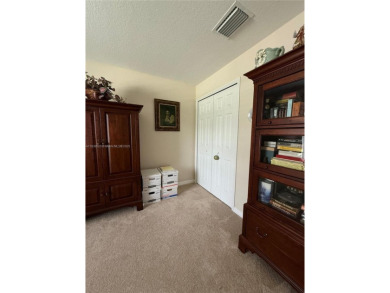 Beautiful golf course home in the 55+ gated community of on Arlington Ridge Golf Club in Florida - for sale on GolfHomes.com, golf home, golf lot