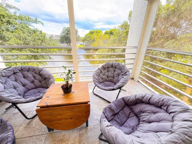Updated top-floor 2BD/2BA condo with stunning lake views in the on Pine Island Ridge Country Club in Florida - for sale on GolfHomes.com, golf home, golf lot