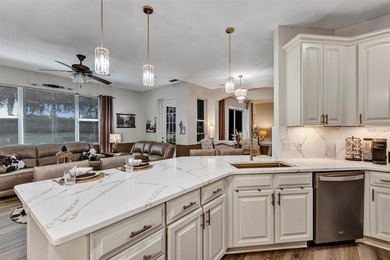 Golf Front 2 Bedroom, 2 bath w/ flex room and over-sized 2 car + on Arlington Ridge Golf Club in Florida - for sale on GolfHomes.com, golf home, golf lot