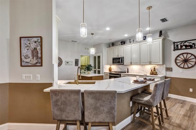 Golf Front 2 Bedroom, 2 bath w/ flex room and over-sized 2 car + on Arlington Ridge Golf Club in Florida - for sale on GolfHomes.com, golf home, golf lot