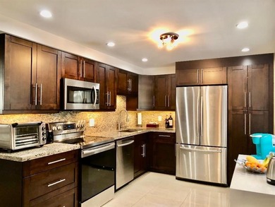 Beautiful fully remodeled pet friendly Cypress Grove Country on Palm-Aire Country Club and Resort - The Oaks in Florida - for sale on GolfHomes.com, golf home, golf lot