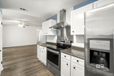This remodeled 3-bedroom, 2-bath brick home is centrally located on Lake Forest Yacht and Country Club in Alabama - for sale on GolfHomes.com, golf home, golf lot