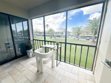 Absolutely Stunning! This 2 Bedroom 2 Bathroom Condo is located on East Lake Woodlands Country Club in Florida - for sale on GolfHomes.com, golf home, golf lot