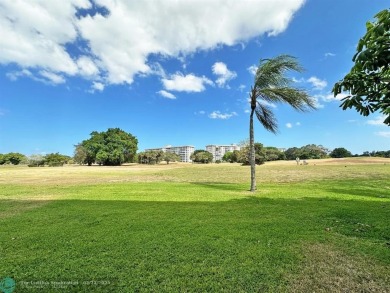 This beautifully updated 1st-floor corner condo offers a perfect on Palm-Aire Country Club and Resort - Palms in Florida - for sale on GolfHomes.com, golf home, golf lot