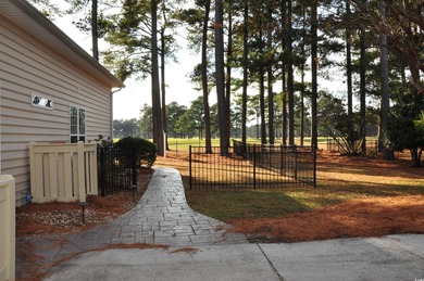 Discover your perfect retreat in this stunning three-bedroom on Mystical Golf Man O War Golf Links in South Carolina - for sale on GolfHomes.com, golf home, golf lot