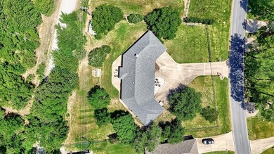 1246 Kiowa Drive West sits on a spacious double lot in the gated on Lake Kiowa Golf Course in Texas - for sale on GolfHomes.com, golf home, golf lot