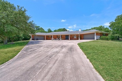 1246 Kiowa Drive West sits on a spacious double lot in the gated on Lake Kiowa Golf Course in Texas - for sale on GolfHomes.com, golf home, golf lot