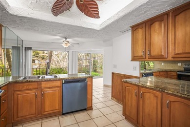 Beautifully updated condo offering modern comfort, effortless on East Bay Golf Club in Florida - for sale on GolfHomes.com, golf home, golf lot