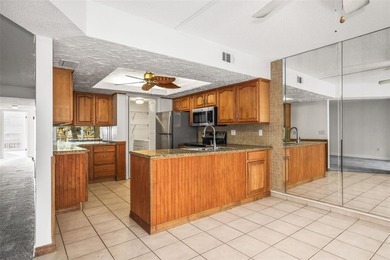 Beautifully updated condo offering modern comfort, effortless on East Bay Golf Club in Florida - for sale on GolfHomes.com, golf home, golf lot
