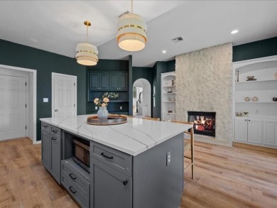 This stunning home, located at the corner of holes 15 and 16 on The Lake Country Club - Lake Waco in Texas - for sale on GolfHomes.com, golf home, golf lot