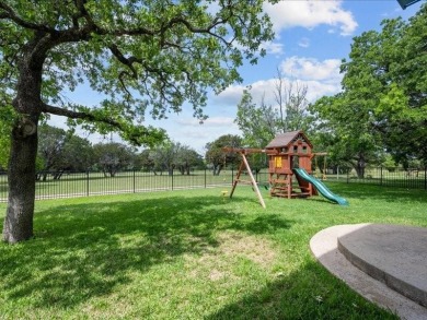 This stunning home, located at the corner of holes 15 and 16 on The Lake Country Club - Lake Waco in Texas - for sale on GolfHomes.com, golf home, golf lot