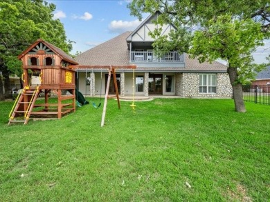 This stunning home, located at the corner of holes 15 and 16 on The Lake Country Club - Lake Waco in Texas - for sale on GolfHomes.com, golf home, golf lot