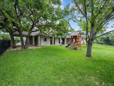 This stunning home, located at the corner of holes 15 and 16 on The Lake Country Club - Lake Waco in Texas - for sale on GolfHomes.com, golf home, golf lot